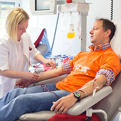 Image showing Blood donor at donation.