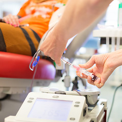 Image showing Nurse and blood donor at donation.