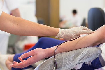 Image showing Nurse and blood donor at donation.