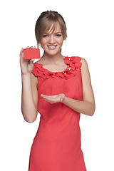 Image showing Beautiful smiling female showing red card in hand