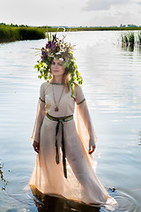 Image showing Beautiful sad woman with flower wreath