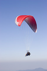 Image showing Red paraglider with two person