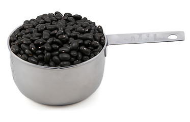 Image showing Black turtle beans in a cup measure