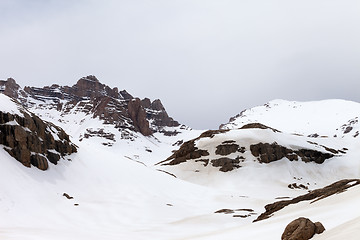 Image showing Snow mountains at cloudy day
