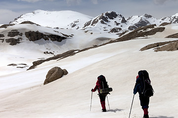 Image showing Two hikers on snowy plateau