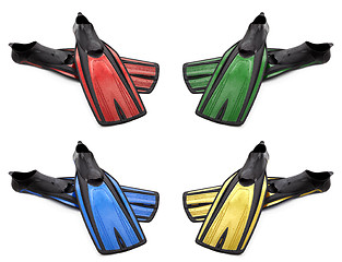 Image showing Set of multicolored flippers for diving with water drops