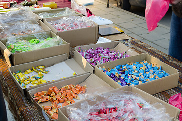 Image showing milky caramel candy in cardboard boxes 