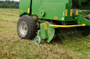 Image showing press machine form round fresh hay straw bale roll 