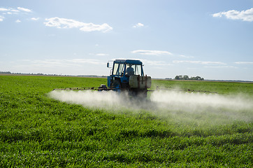 Image showing Tractor spray fertilize field pesticide chemical 