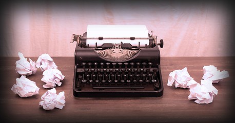 Image showing Vintage typewriter and old books