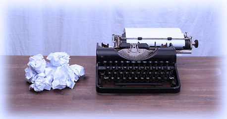 Image showing Vintage typewriter and old books