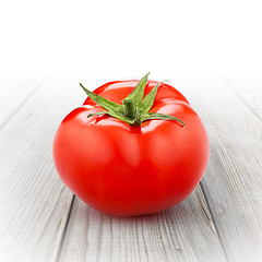 Image showing red tomato isolated on wood