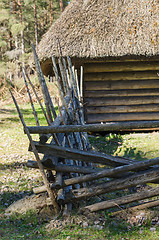 Image showing Old rural building with a roof covered by straw, close-up