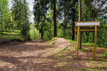 Image showing Wooden sign board on the natural trail. In the 
 forest park