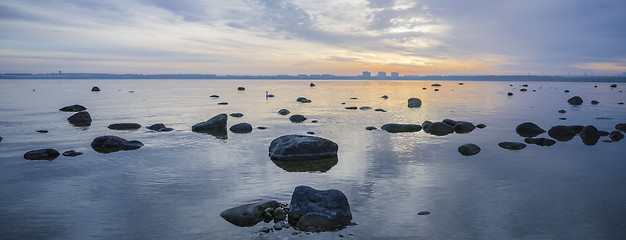 Image showing Beautiful sunrise on the sea. Views of Tallinn.