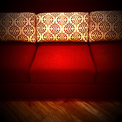 Image showing Red sofa with decorative cushions