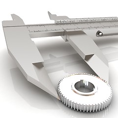 Image showing Vernier caliper measures the cogwheel 