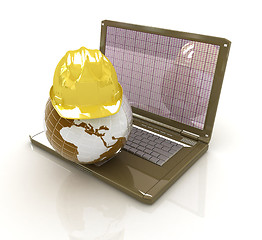 Image showing Hard hat and earth on a laptop 