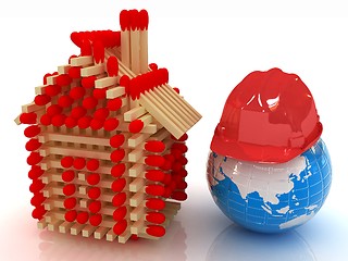 Image showing Log house from matches pattern and hard hat on earth 