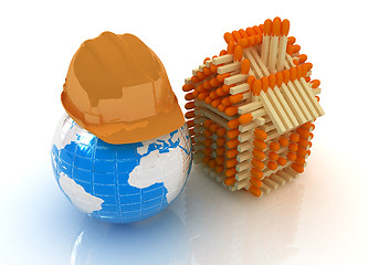 Image showing Log house from matches pattern and hard hat on earth 