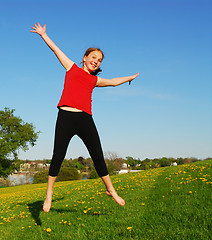 Image showing Young girl jumping