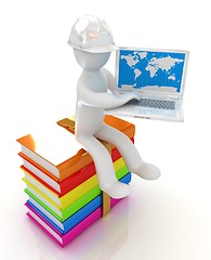 Image showing 3d man in hard hat sitting on books and working at his laptop 