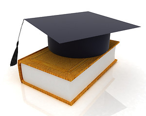 Image showing Graduation hat on a leather book