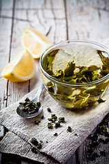 Image showing cup of green tea and lemon