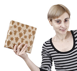 Image showing Young woman holding a present