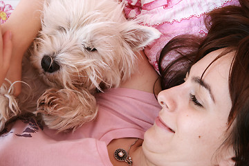 Image showing Dog sleeping on bed 