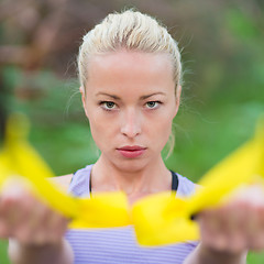 Image showing Training with fitness straps outdoors.