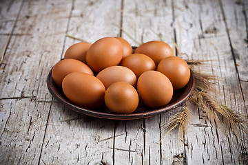 Image showing  fresh brown eggs in plate