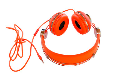 Image showing Bright colored orange headphones isolated 