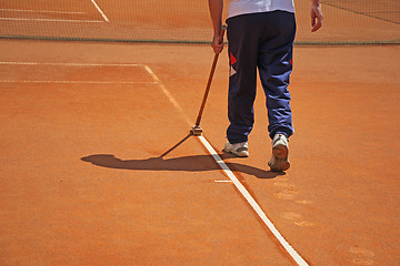 Image showing Cleaning line on a tennis court 