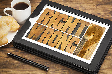 Image showing right or wrong dilemma on tablet