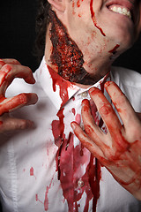 Image showing Psychopath with bloody fingers