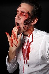 Image showing Psychopath with bloody fingers