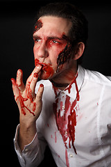 Image showing Psychopath with bloody fingers