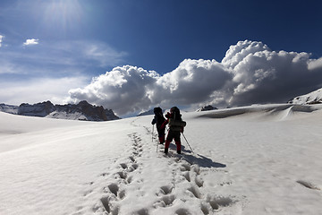 Image showing Two hikers on snowy plateau