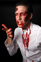 Image showing Psychopath with bloody fingers