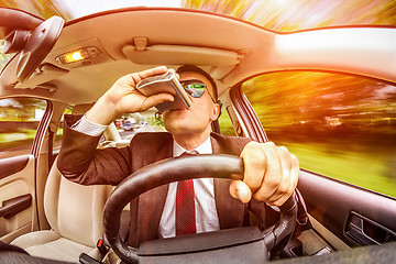 Image showing Drunk man driving a car vehicle.