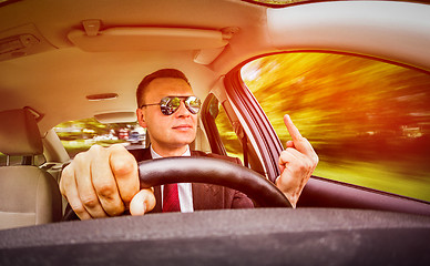 Image showing Man driving a car.