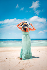 Image showing Girl walking along a tropical beach in the Maldives.