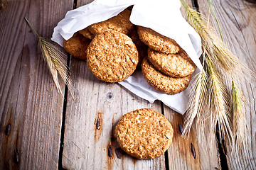 Image showing fresh crispy oat cookies and ears 