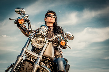 Image showing Biker girl on a motorcycle