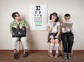 Image showing Three person wearing spectacles in an office at the doctor
