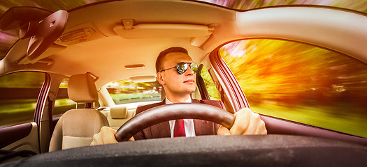 Image showing Man driving a car.