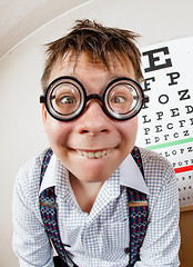 Image showing Funny boy wearing spectacles in an office at the doctor