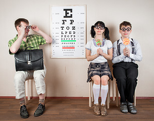 Image showing Three person wearing spectacles in an office at the doctor