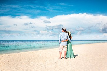 Image showing Vacation Couple walking on tropical beach Maldives.